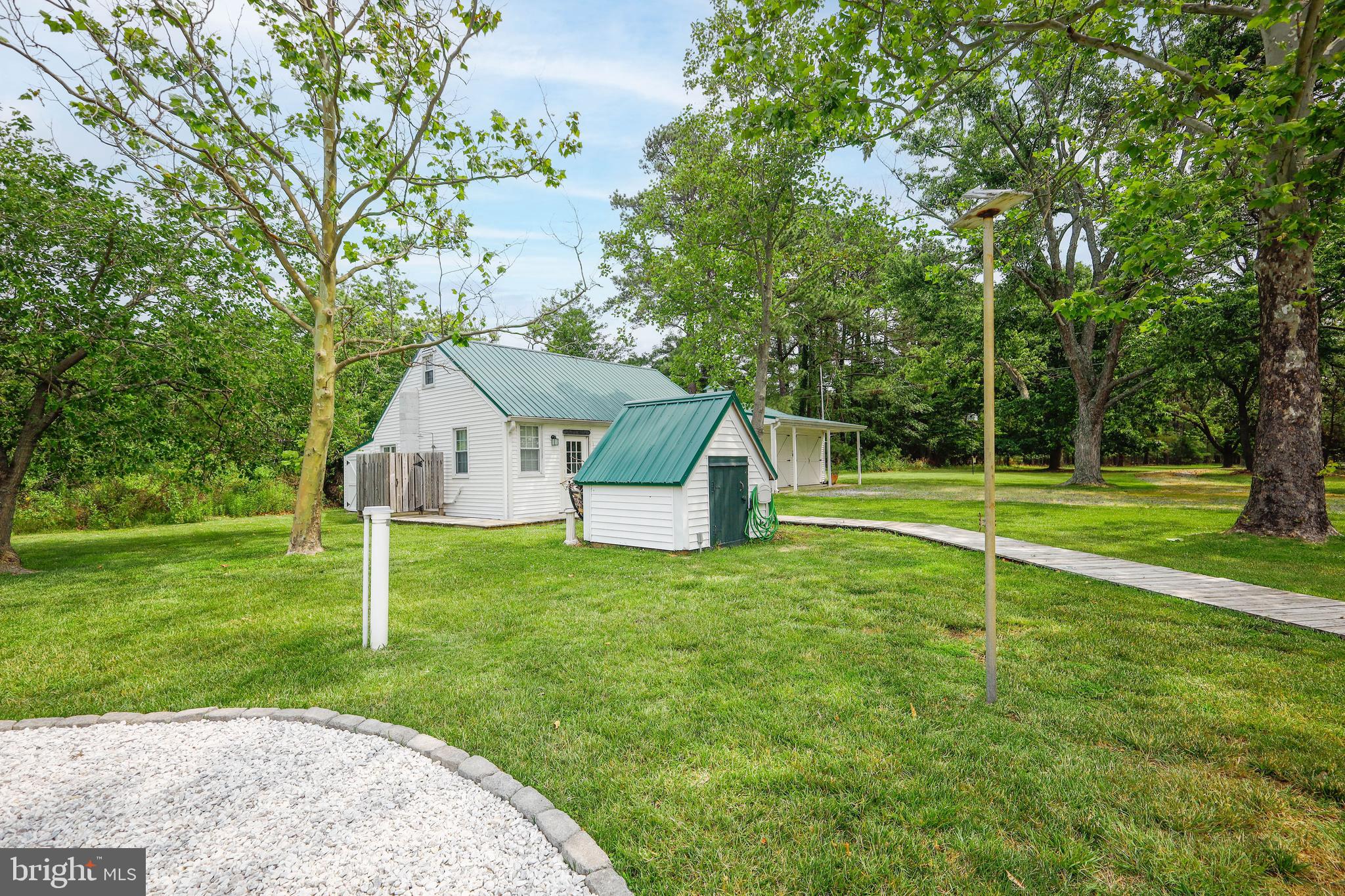 4004 Robinson Neck Road Taylors Island, MD 21669 - Photo 77 of 84 a view of a house with a big yard