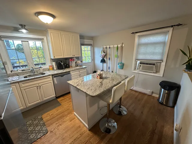 a kitchen with a sink appliances and cabinets