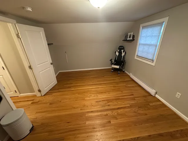 a view of room with window and bathroom