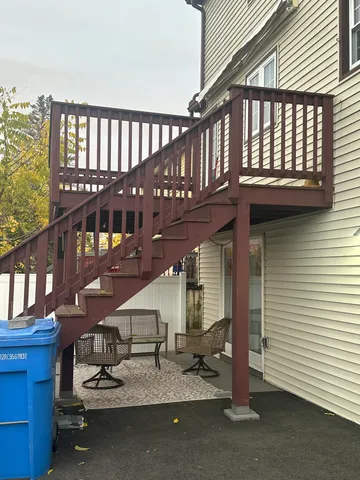 a view of staircase with a stove