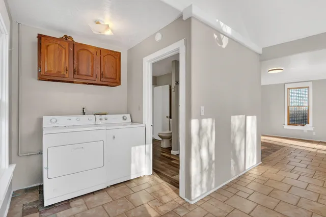 a utility room with cabinets