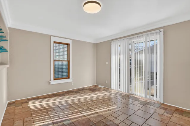a view of a room with wooden floor and windows
