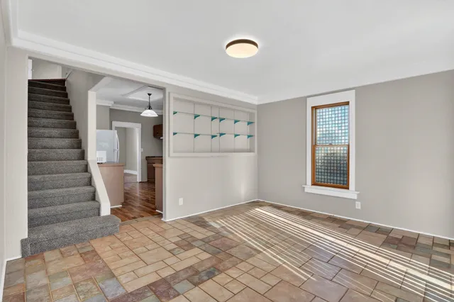 a view of an empty room with a window