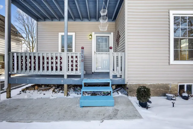a view of a patio with a table and chairs