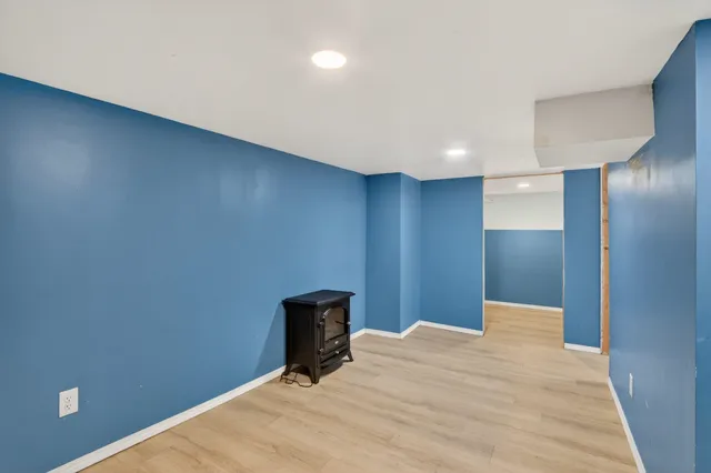 a view of a room with a wooden wall