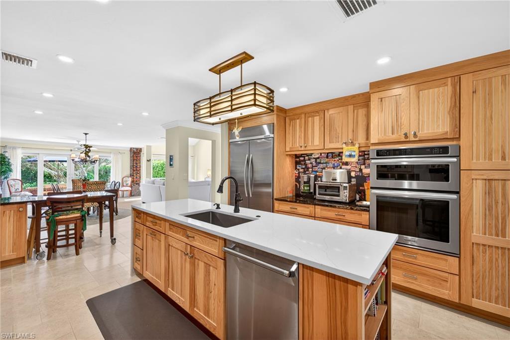 4030 Crayton Road, Unit C2 Naples, FL 34103 - Photo 10 of 32 a kitchen with a sink cabinets and window