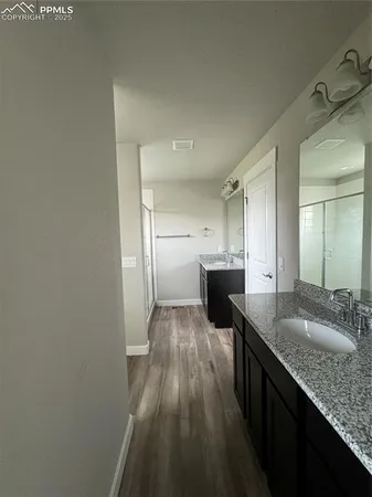 a view of a kitchen from the hallway