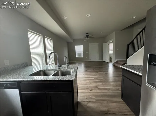 a kitchen with sink and window