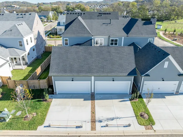an aerial view of a house with a garden