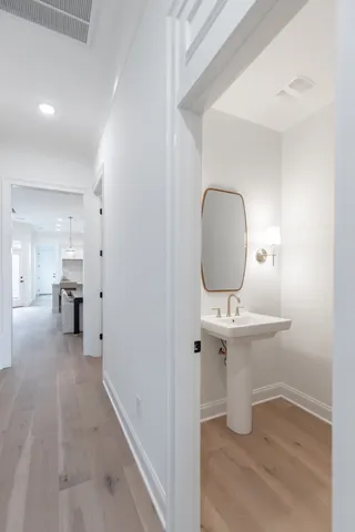 a view of a room with a furniture and mirror