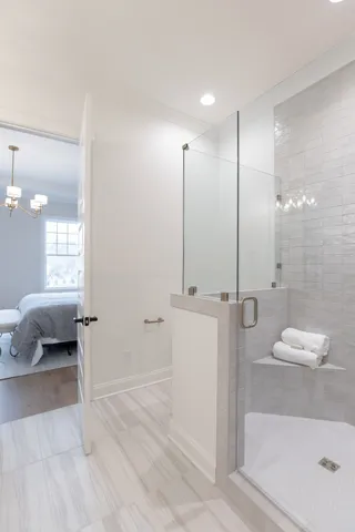 a bathroom with a tub and a shower