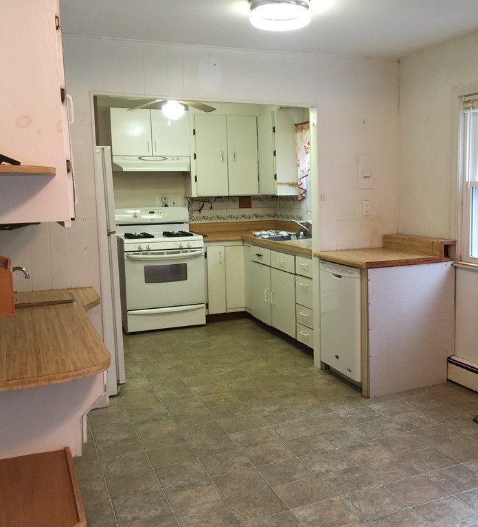 9 Claire Road Amesbury, MA 01913 - Photo 16 of 26 a kitchen with stainless steel appliances a stove a sink and a refrigerator