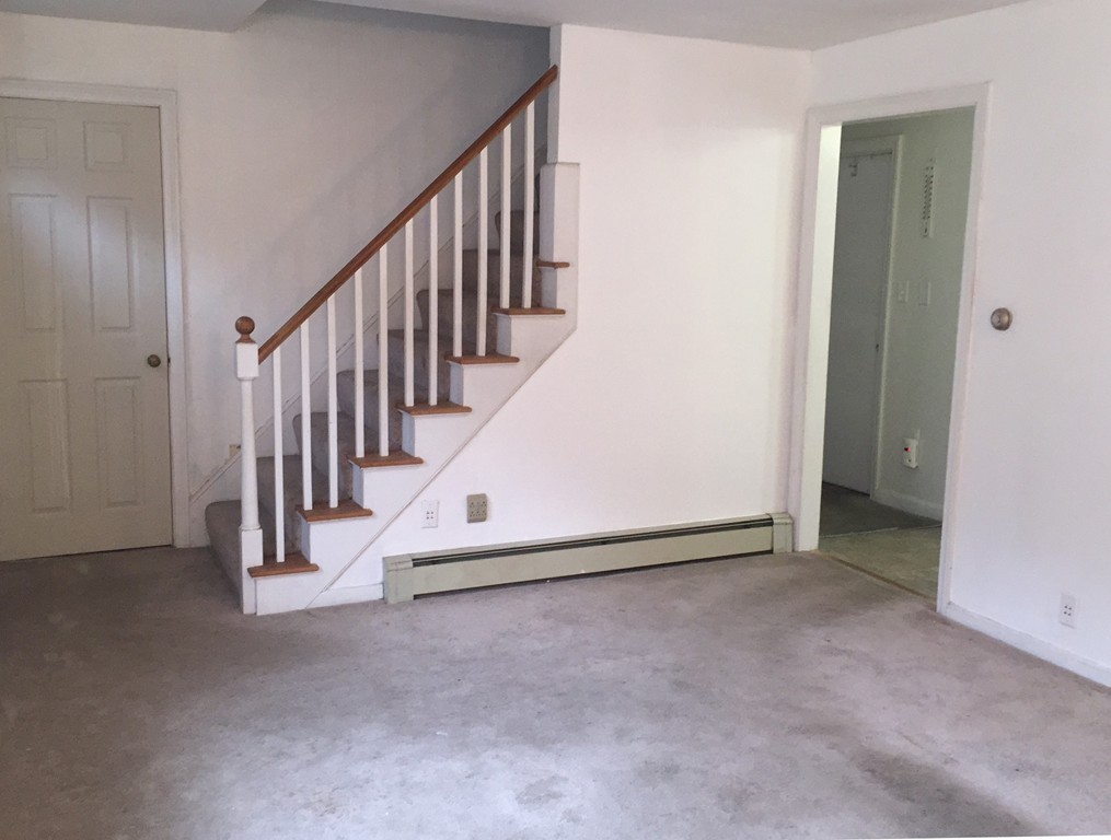 9 Claire Road Amesbury, MA 01913 - Photo 18 of 26 a view of a hallway with staircase