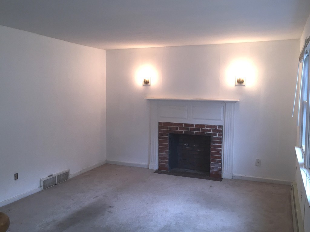 9 Claire Road Amesbury, MA 01913 - Photo 19 of 26 an empty room with a fireplace