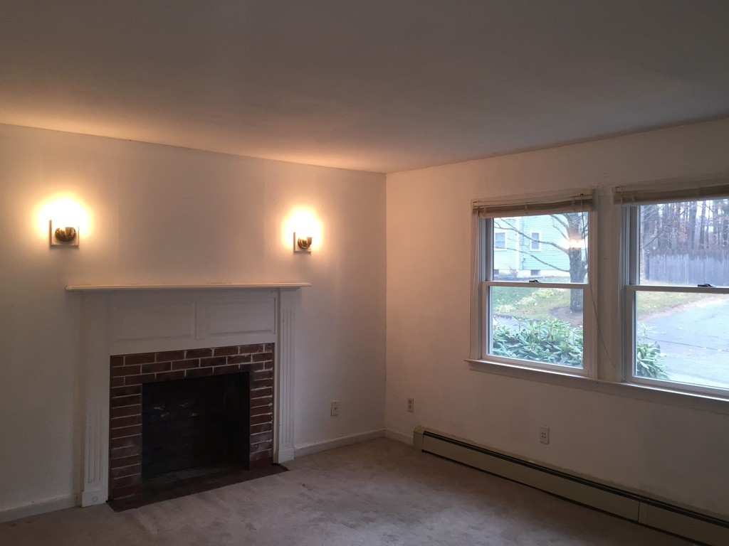 9 Claire Road Amesbury, MA 01913 - Photo 20 of 26 an empty room with windows and fireplace