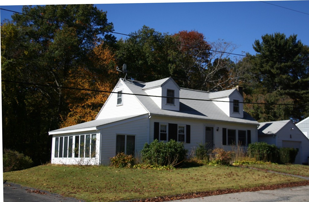 9 Claire Road Amesbury, MA 01913 - Photo 5 of 26 a front view of a house with garden
