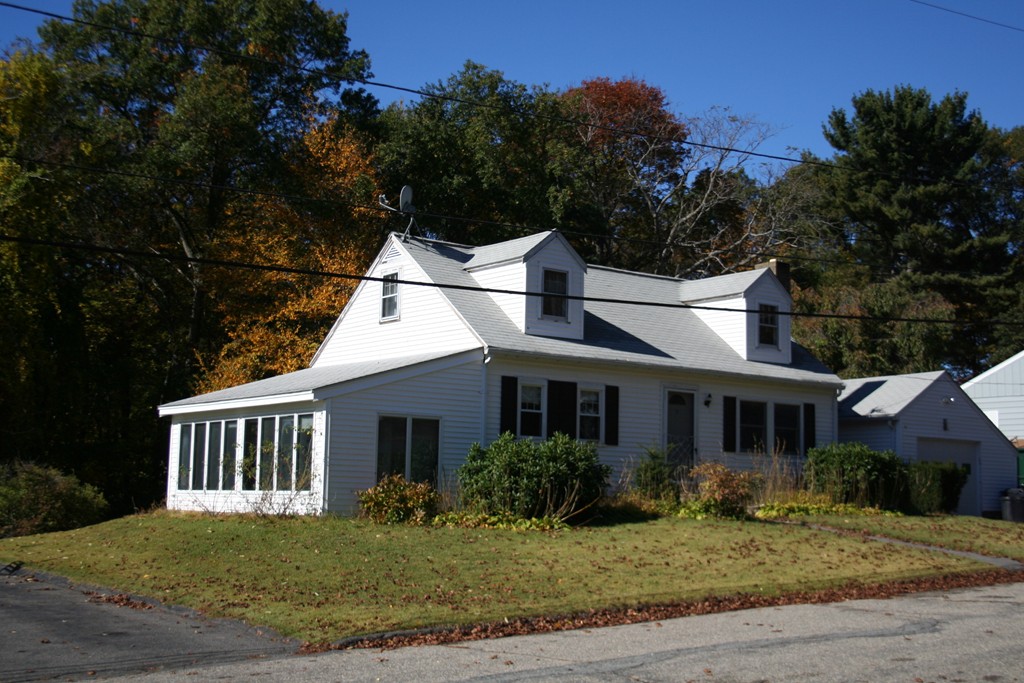 9 Claire Road Amesbury, MA 01913 - Photo 6 of 26 a front view of a house with a yard