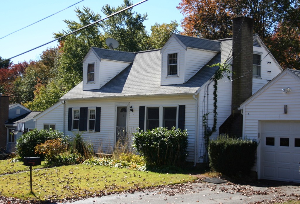 9 Claire Road Amesbury, MA 01913 - Photo 7 of 26 a front view of a house with a yard