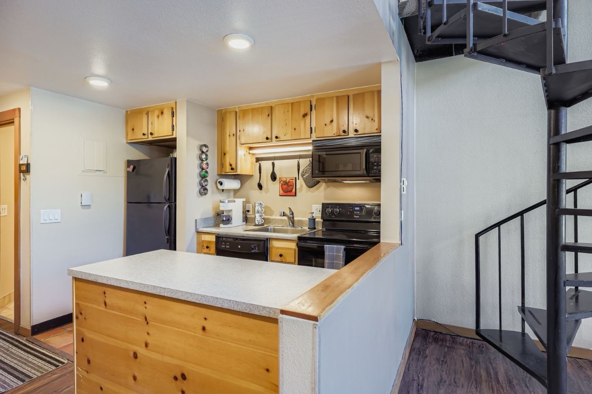 22340 Highway 6, Unit 1784 Keystone, CO 80435 - Photo 6 of 28 a kitchen with stainless steel appliances a refrigerator and a stove