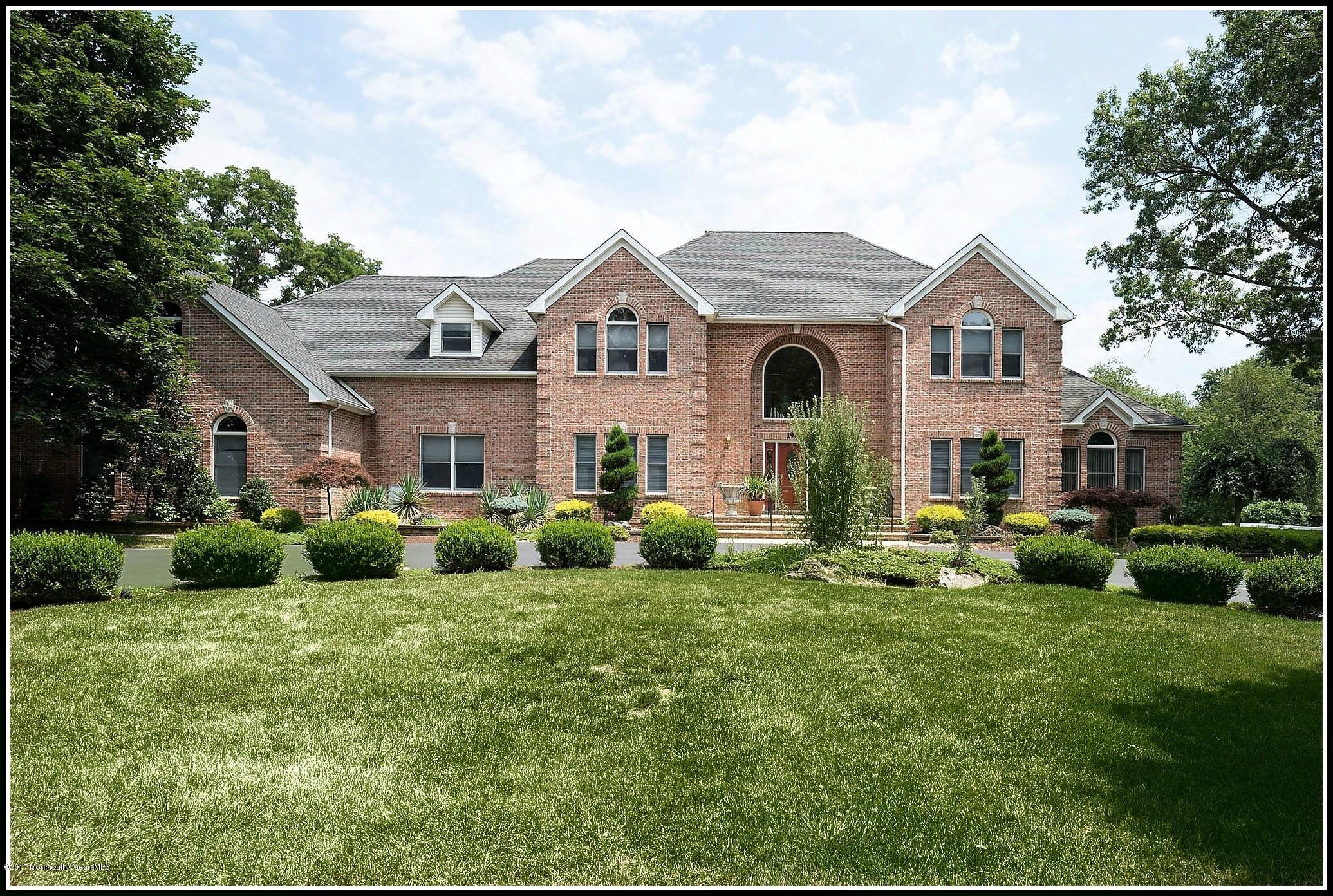 198 Robertsville Road Freehold, NJ 07728 - Photo 1 of 30 a front view of a house with a yard and garage