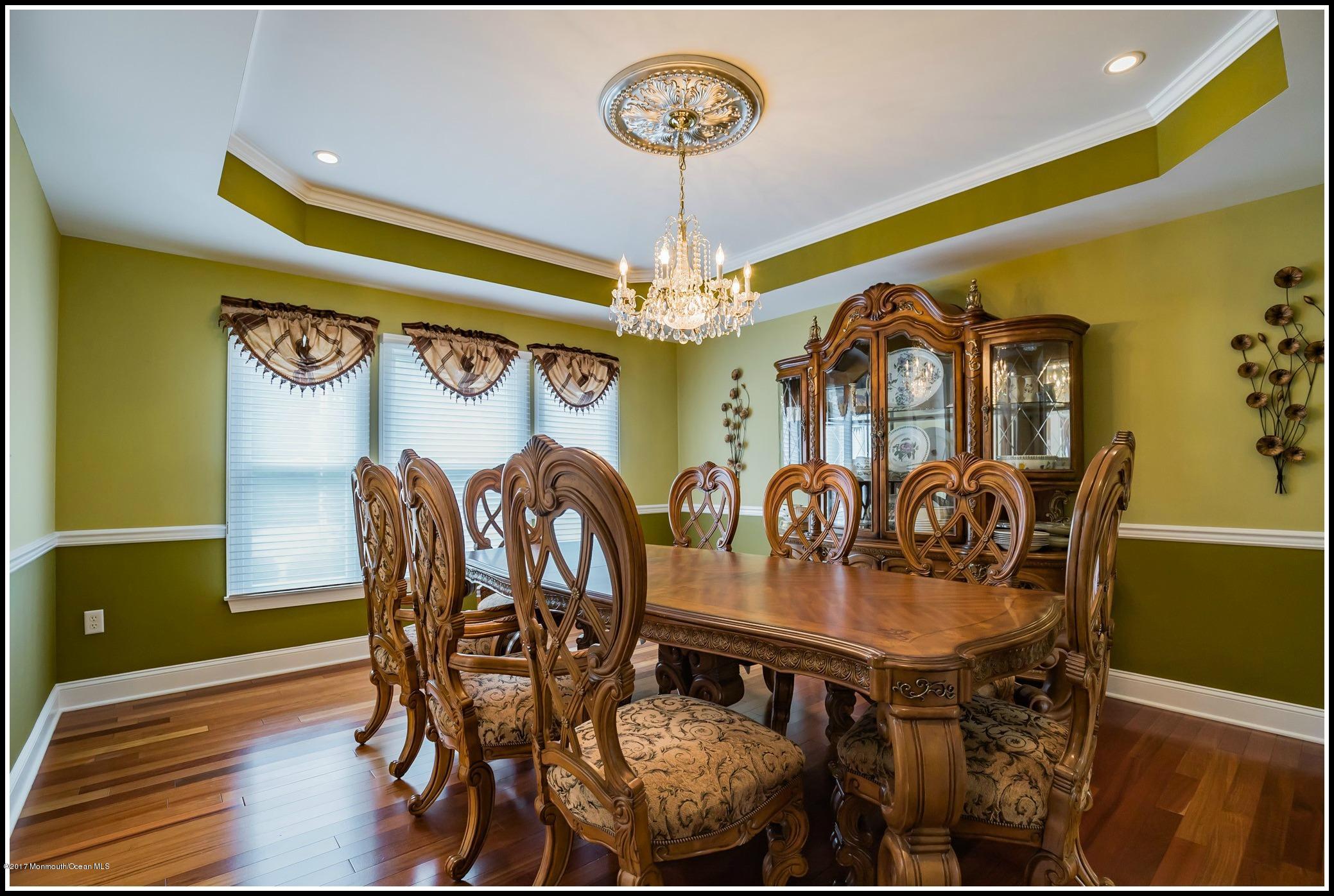 198 Robertsville Road Freehold, NJ 07728 - Photo 12 of 30 a view of a dining room with furniture and chandelier