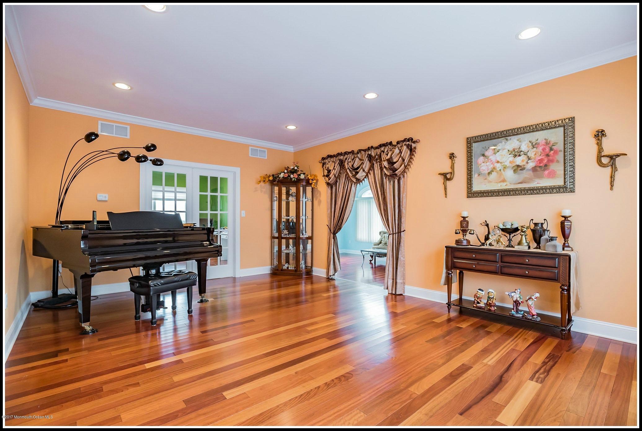 198 Robertsville Road Freehold, NJ 07728 - Photo 13 of 30 a living room with furniture and a wooden floor