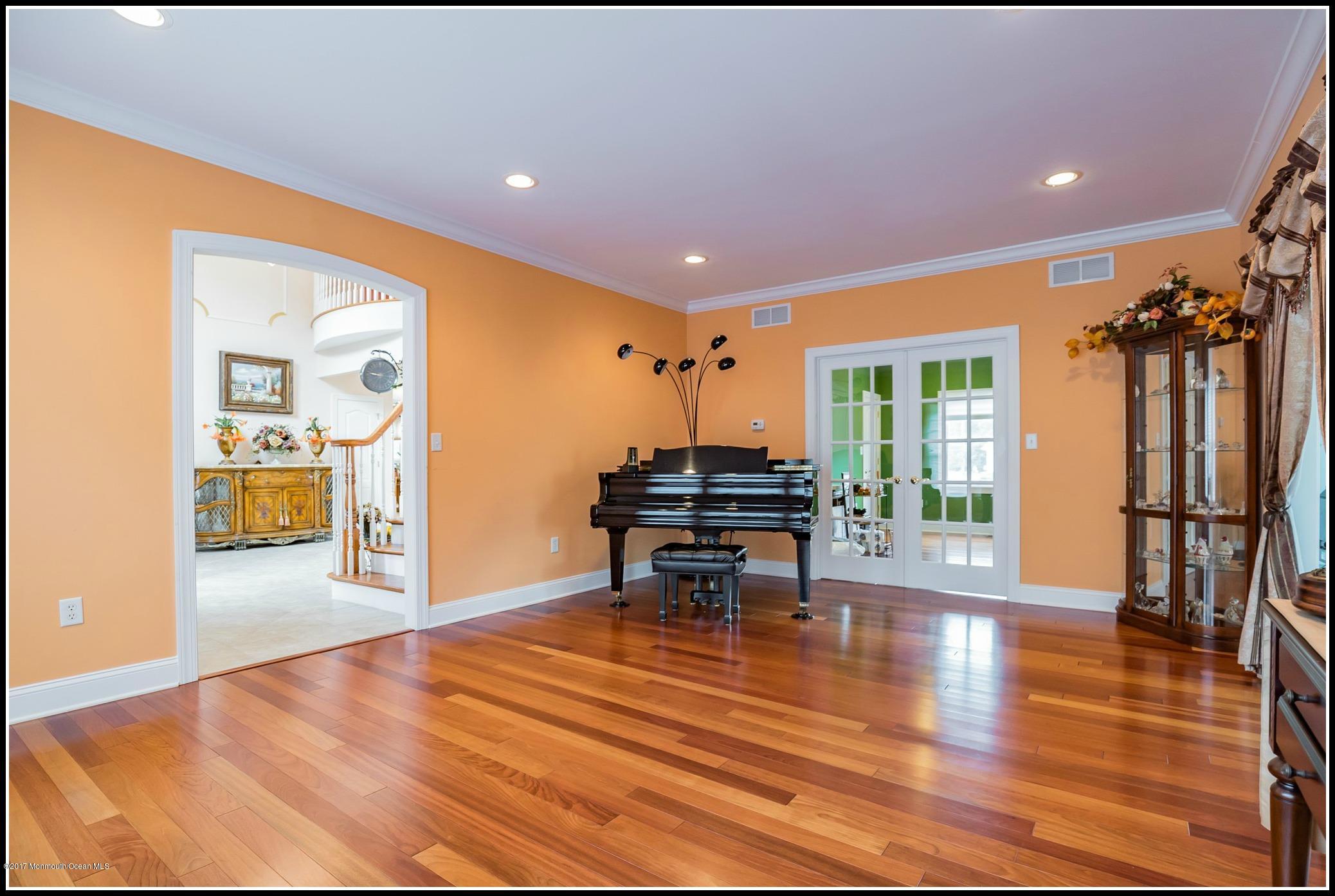 198 Robertsville Road Freehold, NJ 07728 - Photo 14 of 30 a dining room with furniture and a wooden floor