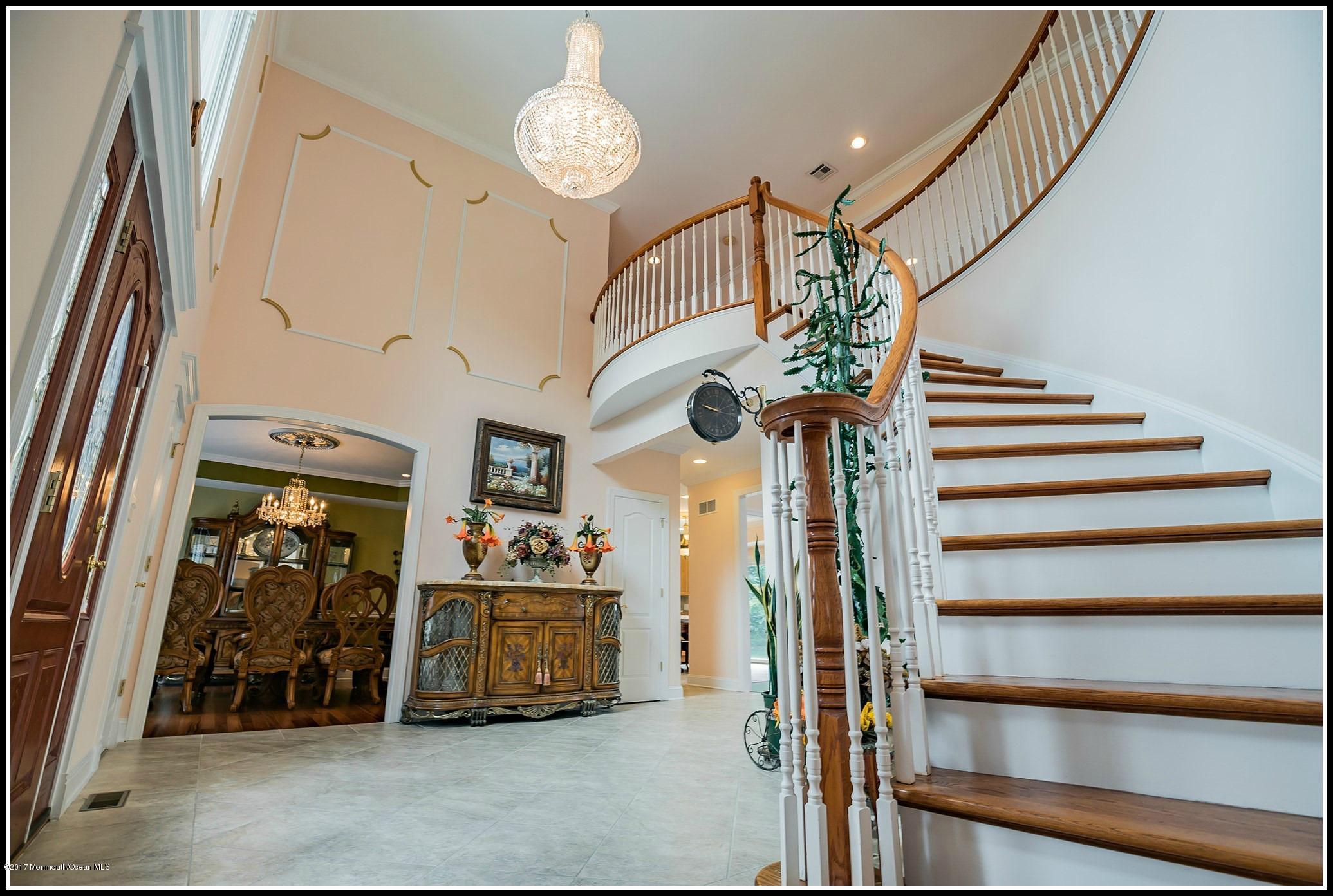 198 Robertsville Road Freehold, NJ 07728 - Photo 2 of 30 a view of a hallway with entryway wooden floor and front door