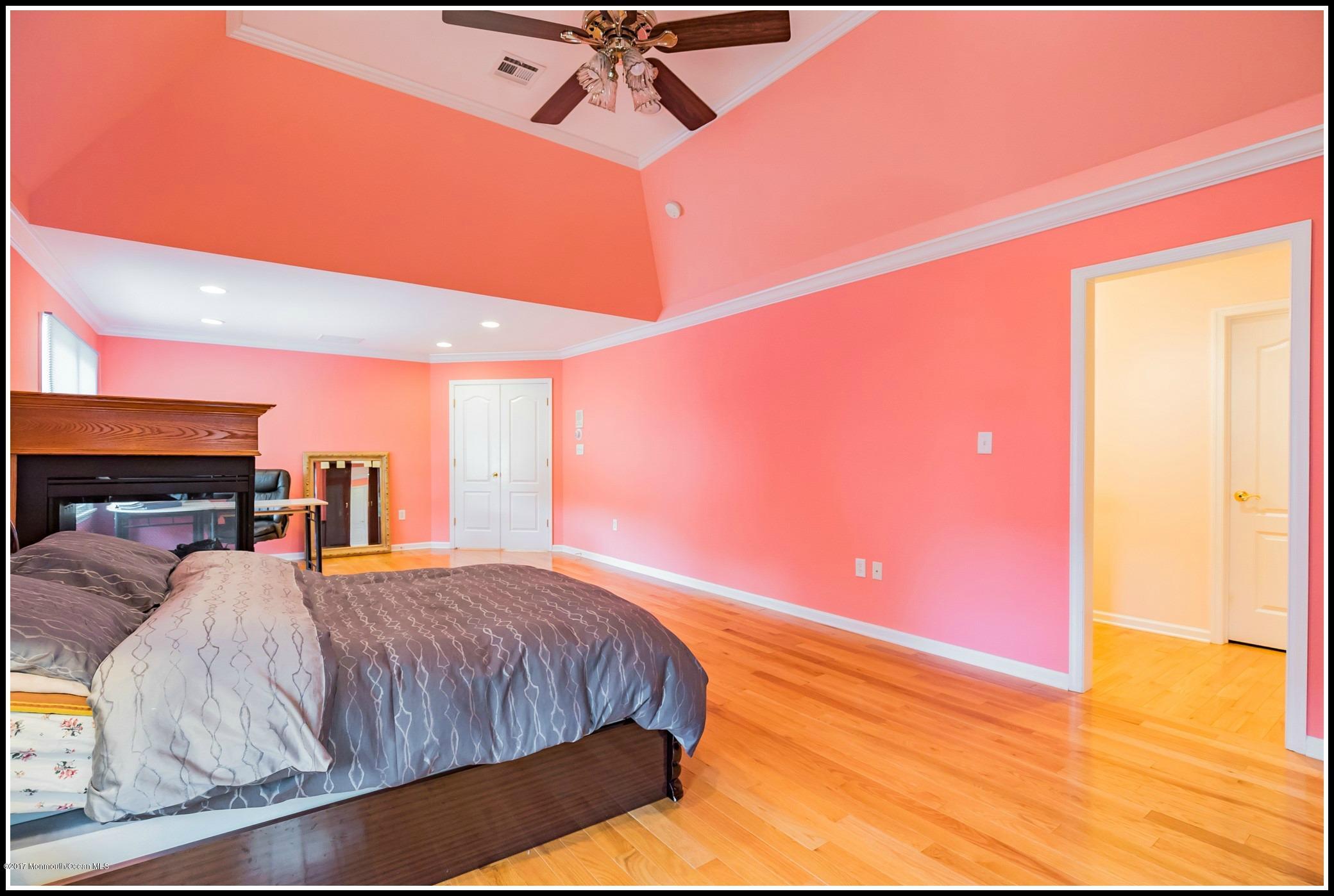 198 Robertsville Road Freehold, NJ 07728 - Photo 21 of 30 a bedroom with a bed and a potted plant