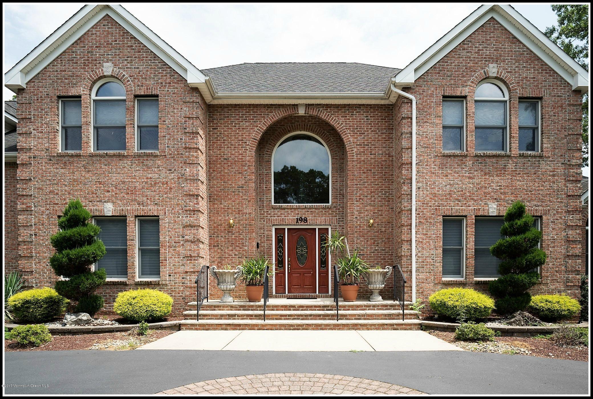 198 Robertsville Road Freehold, NJ 07728 - Photo 29 of 30 a front view of a house with garden