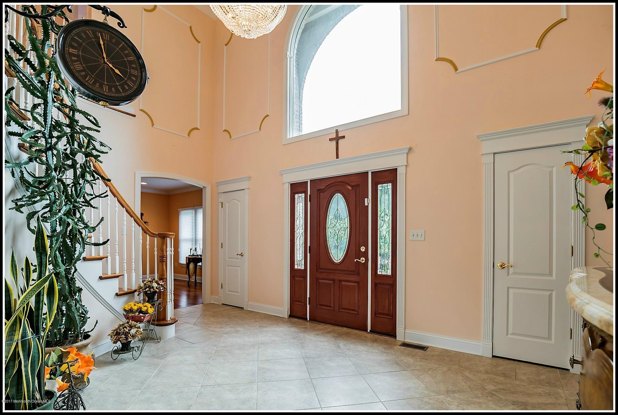 198 Robertsville Road Freehold, NJ 07728 - Photo 4 of 30 an entryway with a washer and dryer
