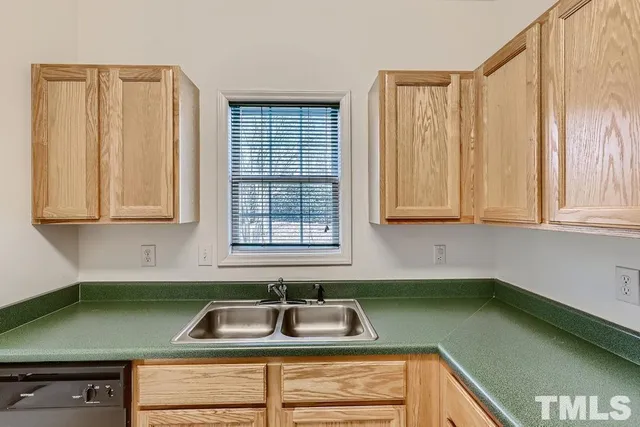 a kitchen with a sink and a window