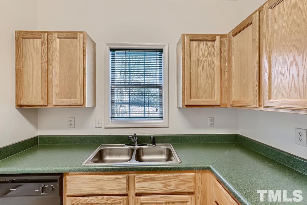 205 Bridgepath Drive Cary, NC 27513 - Photo 12 of 28 a kitchen with a sink and a window
