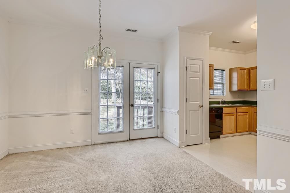 205 Bridgepath Drive Cary, NC 27513 - Photo 15 of 28 a view of a kitchen with refrigerator and cabinets