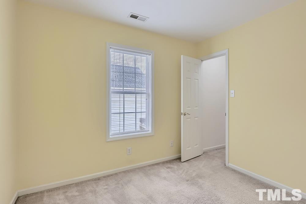 205 Bridgepath Drive Cary, NC 27513 - Photo 22 of 28 an empty room with windows