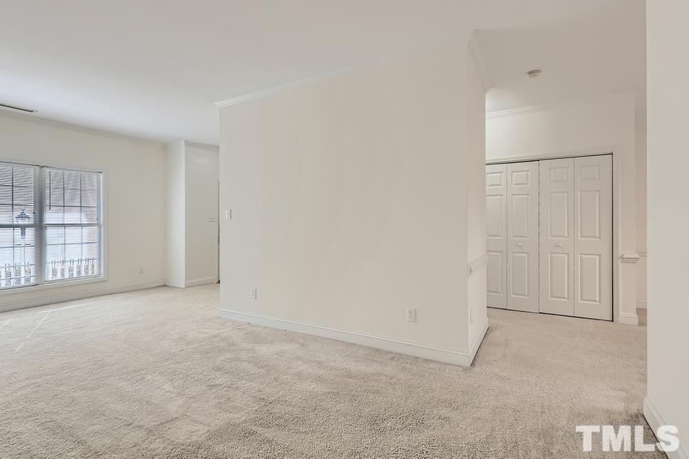 205 Bridgepath Drive Cary, NC 27513 - Photo 9 of 28 an empty room with windows