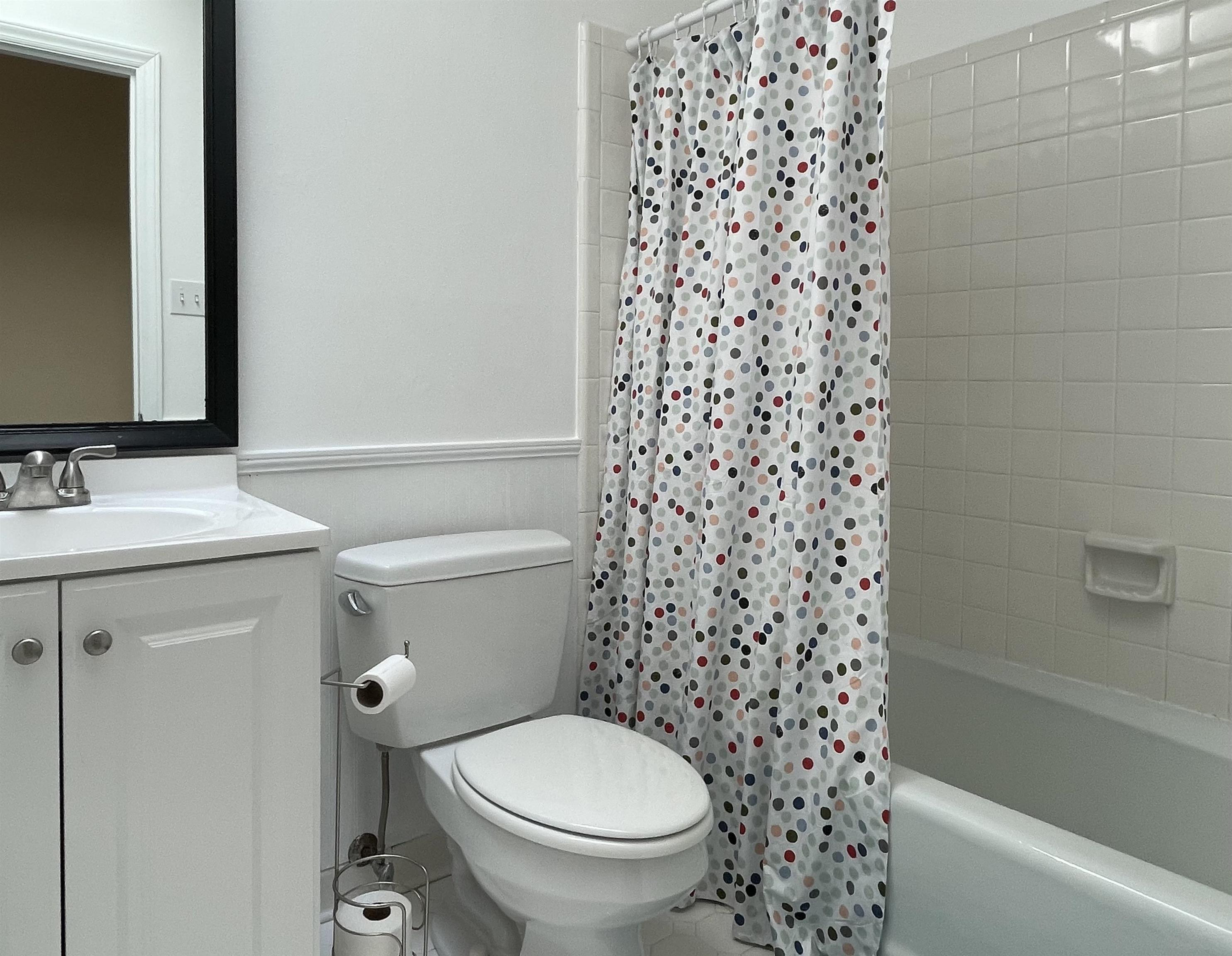 4506 Malvern Road Durham, NC 27707 - Photo 29 of 40 Shared second full bathroom brightened by skylight Hall bathroom