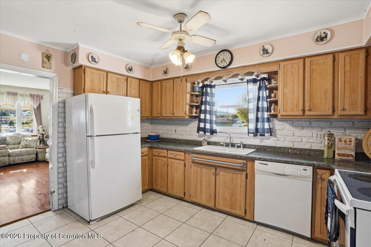 101 Stone Street Moosic, PA 18507 - Photo 11 of 53 a kitchen with cabinets a refrigerator and a sink