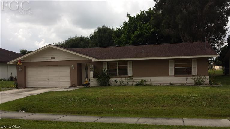 7436 Pebble Beach Road Fort Myers, FL 33967 - Photo 1 of 17 a front view of house with yard and green space
