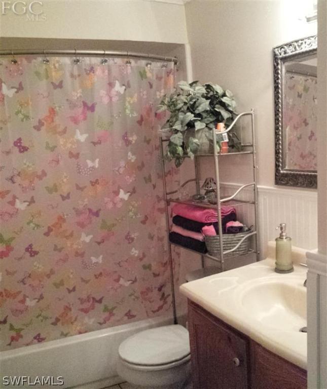 7436 Pebble Beach Road Fort Myers, FL 33967 - Photo 11 of 17 a bathroom with a sink toilet and a mirror