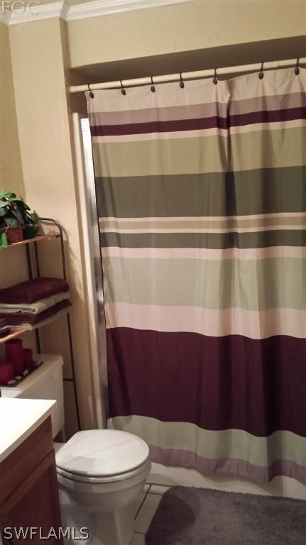 7436 Pebble Beach Road Fort Myers, FL 33967 - Photo 14 of 17 a bathroom with a toilet and a sink