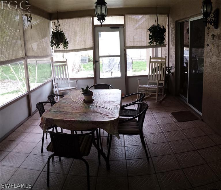 7436 Pebble Beach Road Fort Myers, FL 33967 - Photo 15 of 17 a view of a dining room with furniture window and outside view