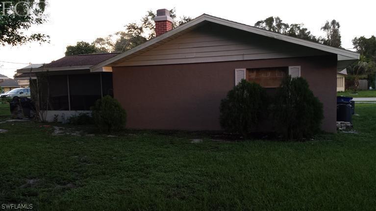7436 Pebble Beach Road Fort Myers, FL 33967 - Photo 16 of 17 a front view of house with garden