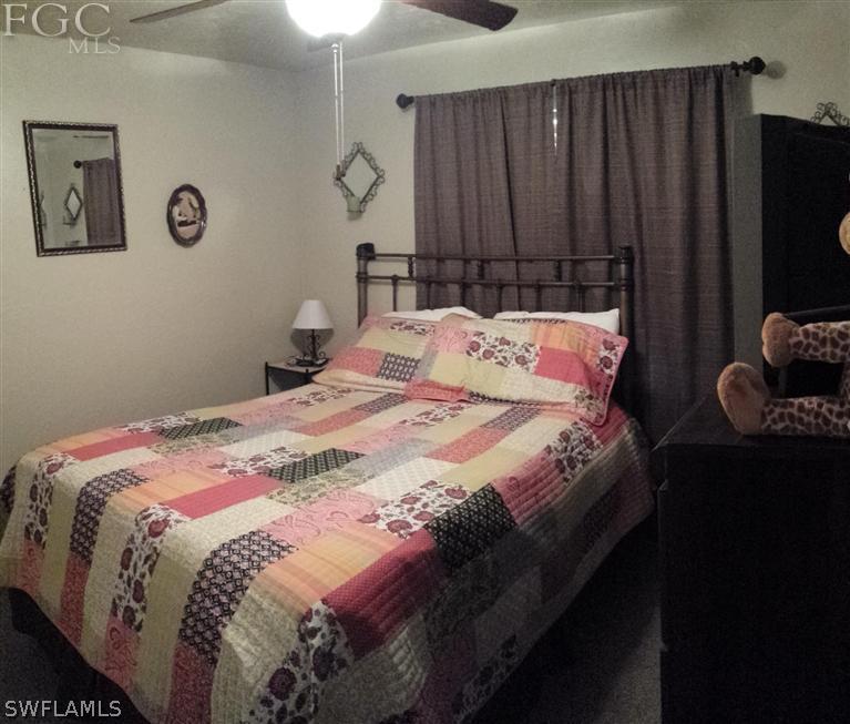 7436 Pebble Beach Road Fort Myers, FL 33967 - Photo 10 of 17 a bedroom with a bed and a closet