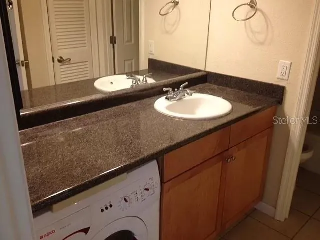 a bathroom with a sink and a mirror