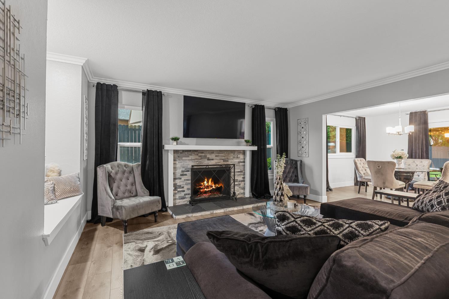 7135 Mathis Court Citrus Heights, CA 95610 - Photo 11 of 39 a living room with furniture fireplace and a large window