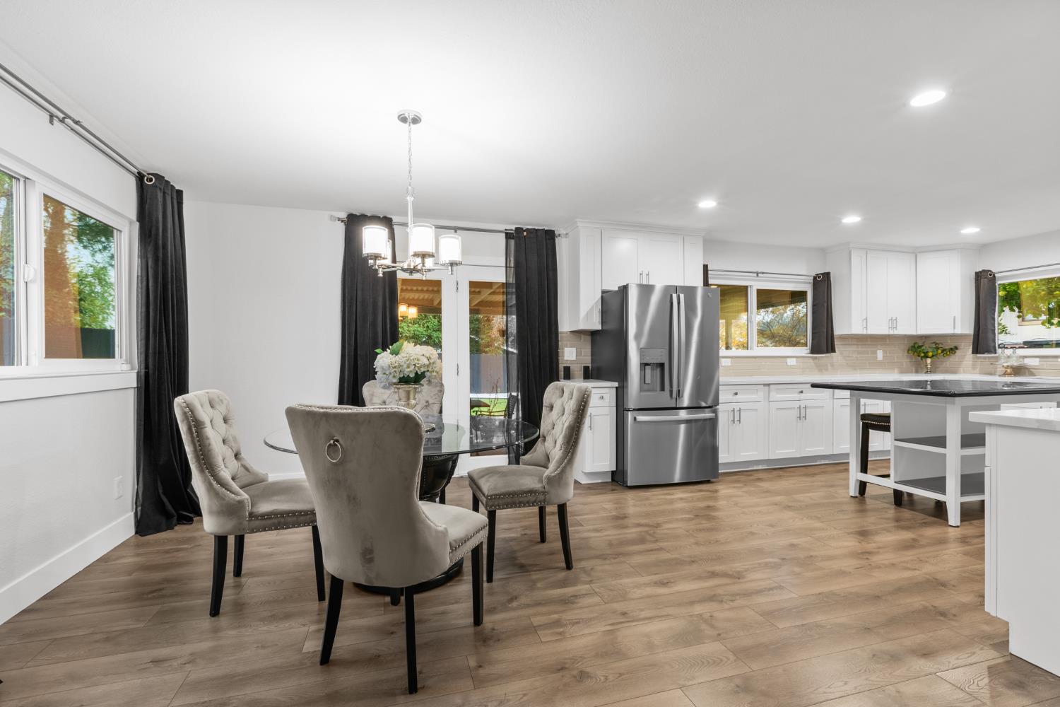 7135 Mathis Court Citrus Heights, CA 95610 - Photo 12 of 39 a living room with furniture a dining table and kitchen view