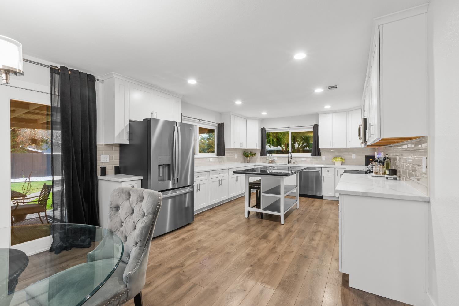 7135 Mathis Court Citrus Heights, CA 95610 - Photo 13 of 39 a kitchen with refrigerator and chairs