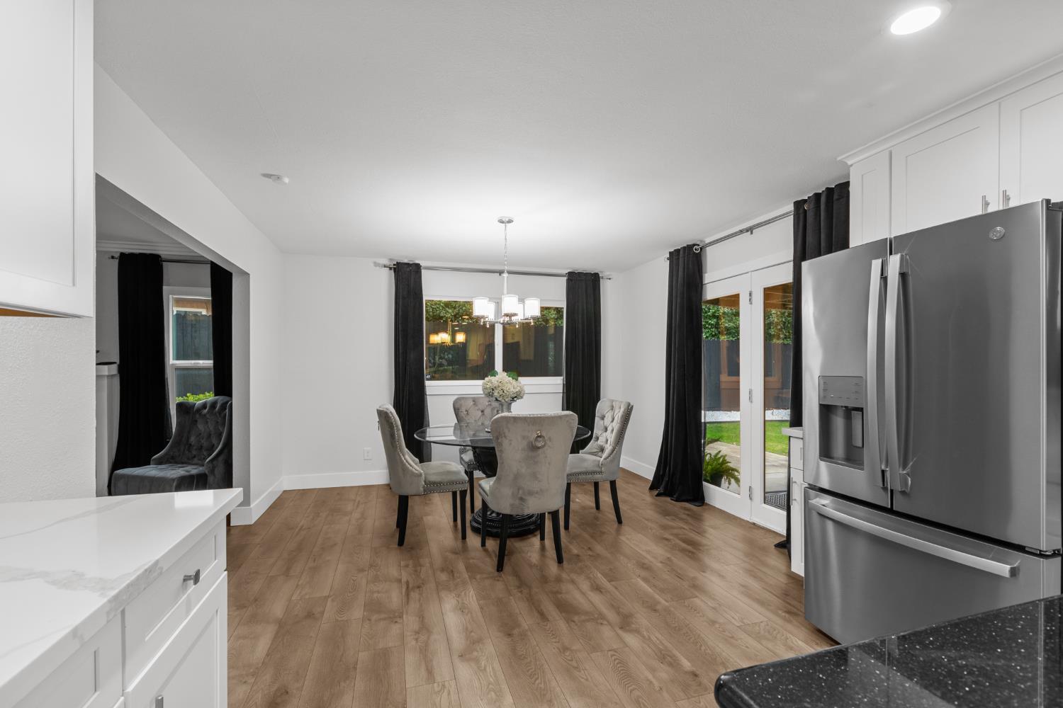 7135 Mathis Court Citrus Heights, CA 95610 - Photo 16 of 39 a dining room with furniture and wooden floor