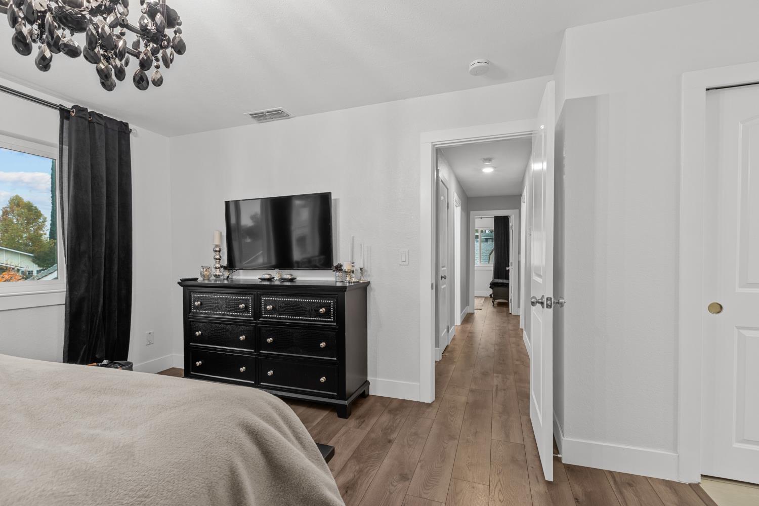 7135 Mathis Court Citrus Heights, CA 95610 - Photo 24 of 39 a bedroom with a bed and a flat screen tv